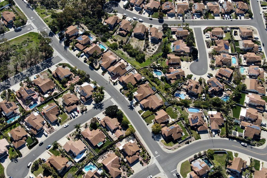 Thrift Realty, LLC - Aerial View of Residential and Modern Subdivision Luxury Houses with Swimming Pools on a Sunny Summer Day